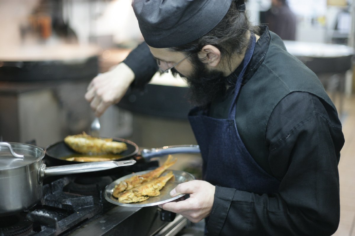 monk cooking fish on Mount Athos